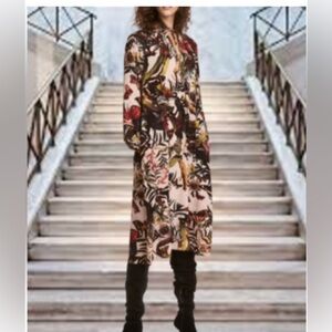 H&M dress featuring a flora and fauna pattern.